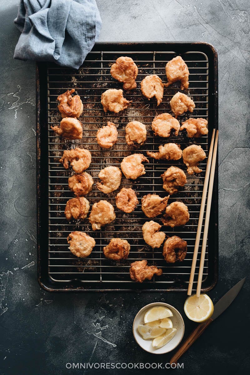 3-Ingredient Fried Shrimp is the easiest fried shrimp recipe that generates the best results. The juicy shrimp are wrapped in a light, crispy, and fluffy crust that is similar to tempura. So good! #seafood #recipes #shrimp Fried shrimp on cooking rack