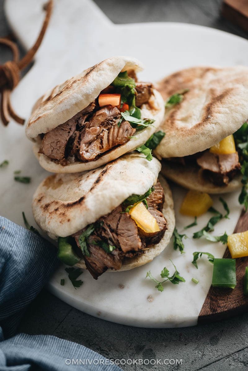 This super fast and easy flatbread recipe will totally blow your mind because it uses only 2 ingredients and 15 minutes of active cooking. You can use it to make pork belly buns or serve the bread with curry. So versatile! #vegetarian #vegan #bread #easy #recipes