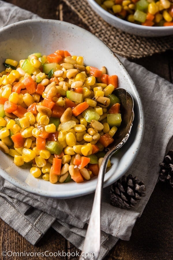 Stir Fried Corn with Pine Nuts (松仁玉米) - The sweet corn kernels, pine nuts, cucumber, and carrot are lightly seasoned with green onion, salt, and sugar. Every ingredient comes together to create a hearty meal that is nutty and sweet | www.nrtjwh.eu.org