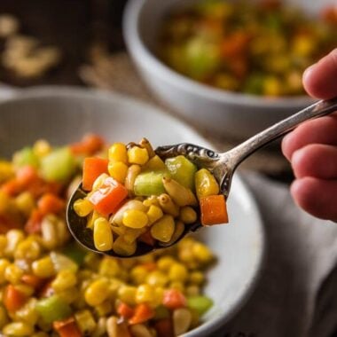 Stir Fried Corn with Pine Nuts (松仁玉米) - The sweet corn kernels, pine nuts, cucumber, and carrot are lightly seasoned with green onion, salt, and sugar. Every ingredient comes together to create a hearty meal that is nutty and sweet | www.nrtjwh.eu.org