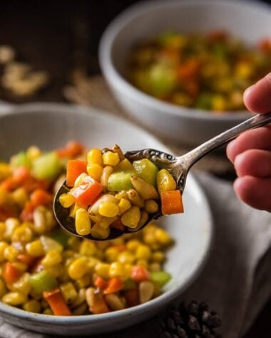 Stir Fried Corn with Pine Nuts (松仁玉米) - The sweet corn kernels, pine nuts, cucumber, and carrot are lightly seasoned with green onion, salt, and sugar. Every ingredient comes together to create a hearty meal that is nutty and sweet | www.nrtjwh.eu.org