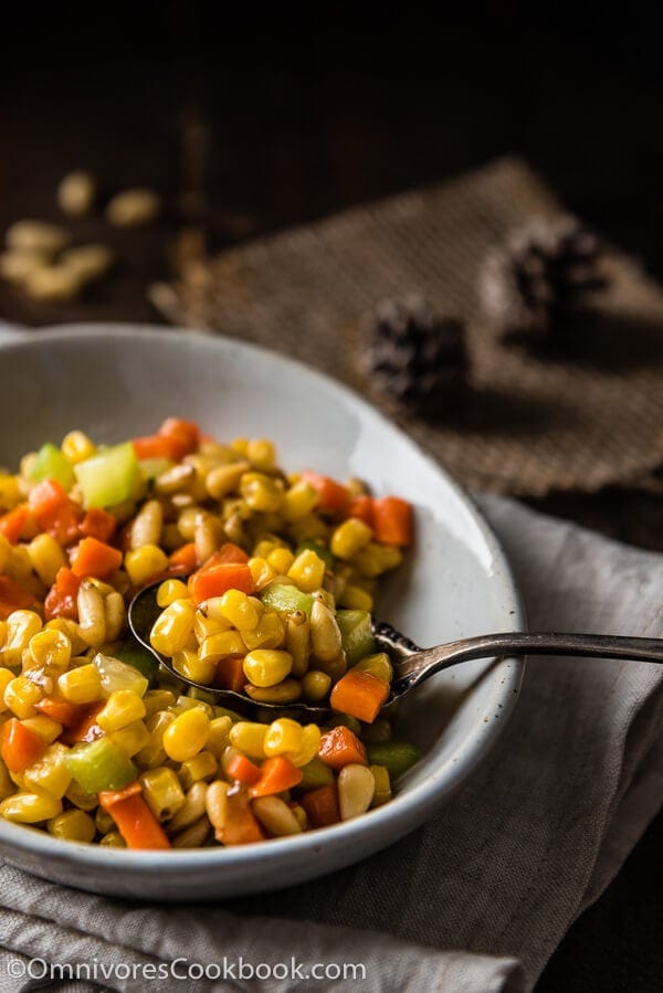 Stir Fried Corn with Pine Nuts (松仁玉米) - The sweet corn kernels, pine nuts, cucumber, and carrot are lightly seasoned with green onion, salt, and sugar. Every ingredient comes together to create a hearty meal that is nutty and sweet | www.nrtjwh.eu.org