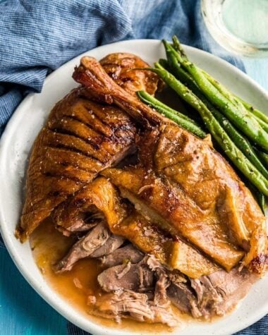 The Best Slow Roast Duck (A recipe from a chef) - The duck is stuffed with citrus, then slow cooked until the meat is falling off the bones and the skin perfectly crisped. | www.nrtjwh.eu.org
