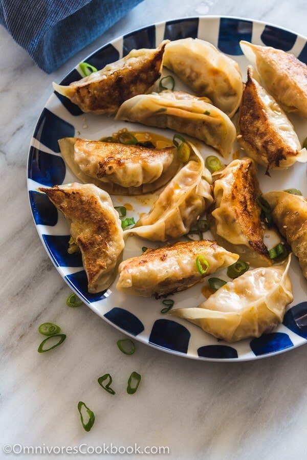 Carrot Dumplings - An elegant vegetarian dumpling that uses carrots, bamboo shoots, mushrooms, and eggs to create a fresh, moist, and rich filling.
