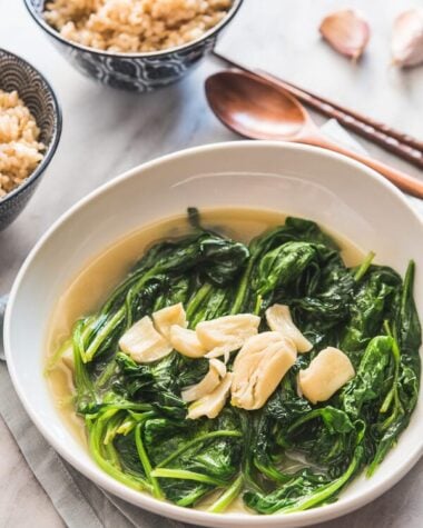 Garlic Spinach in Chicken Broth (上汤菠菜) - The tender spinach is served in a rich and garlicky broth. Originally a restaurant dish, now you can easily make it at home to add delicious leafy greens to your dinner.