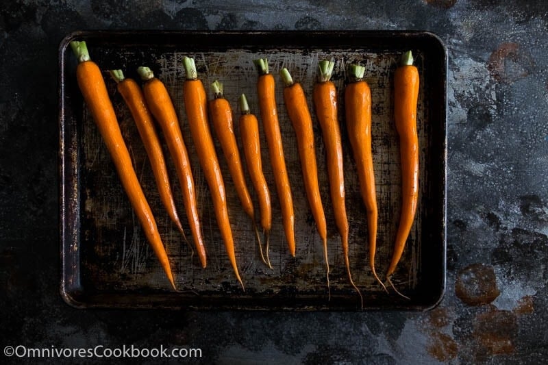 raw carrots on a pan sheet