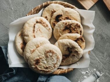 A dozen flatbreads served in bamboo basket