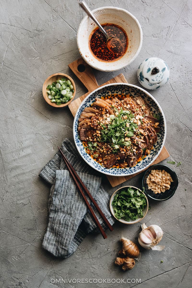 This Fu Qi Fei Pian (Sichuan Sliced Beef in Chili Sauce) recipe gives you the real-deal Sichuan experience. The tender beef slices are served in a rich, spicy hot sauce and topped with peanut flakes and cilantro. #glutenfree #beef #instantpot #chinese #recipes Assembled Fu Qi Fei Pian with Sichuan chili sauce and aromatics