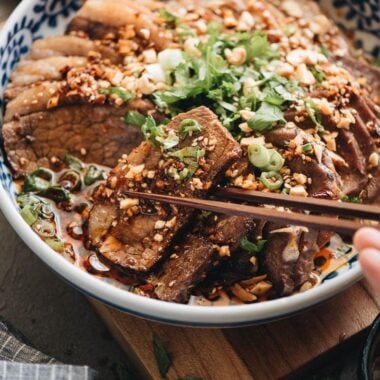 Picking a piece of beef brisket from Fu Qi Fei Pian plate