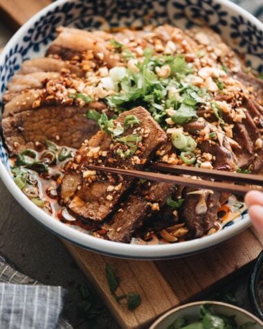 Picking a piece of beef brisket from Fu Qi Fei Pian plate