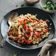 Instant Pot Chicken and Rice (A Pressure Cooker Recipe) - An easy one-pot meal prepared with Asian-style seasonings. The tender rice, juicy chicken, and colorful peppers are cooked with a gingery, garlicky flavor. So irresistible! {Gluten free adaptable} #recipes #asian #onepot #healthy