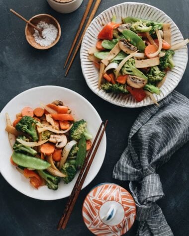 Stir fried vegetables including onion, broccoli, carrot, mushroom, bamboo shoot, and snow peas