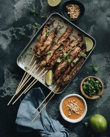 Beef satay served with peanut sauce and cilantro