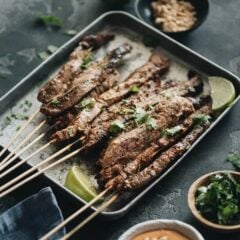 Beef Satay - Skewers of flavorful beef get that perfect char over the Chinese grill and are served with a sweet, tangy and totally craveable peanut sauce. #marinade #recipe #sticks #gluten-free
