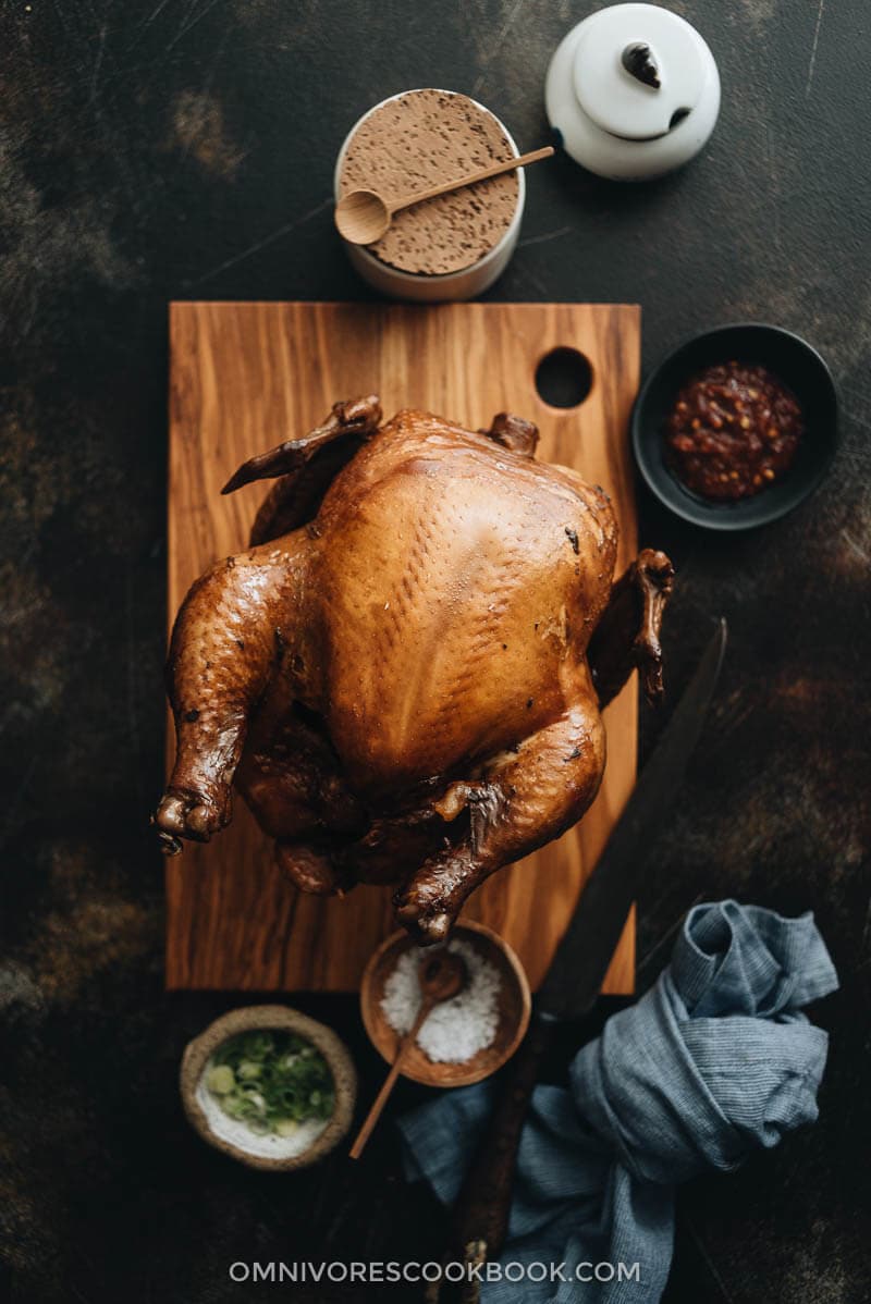 Chinese Soy Sauce Chicken - This homemade soy sauce chicken has silky tender meat with a deep savory flavor. Learn how easy it is to make this Cantonese dim sum at home and even achieve restaurant taste. #marinade #recipe #healthy #glutenfree #brownsugar Homemade soy sauce chicken on a cutting board