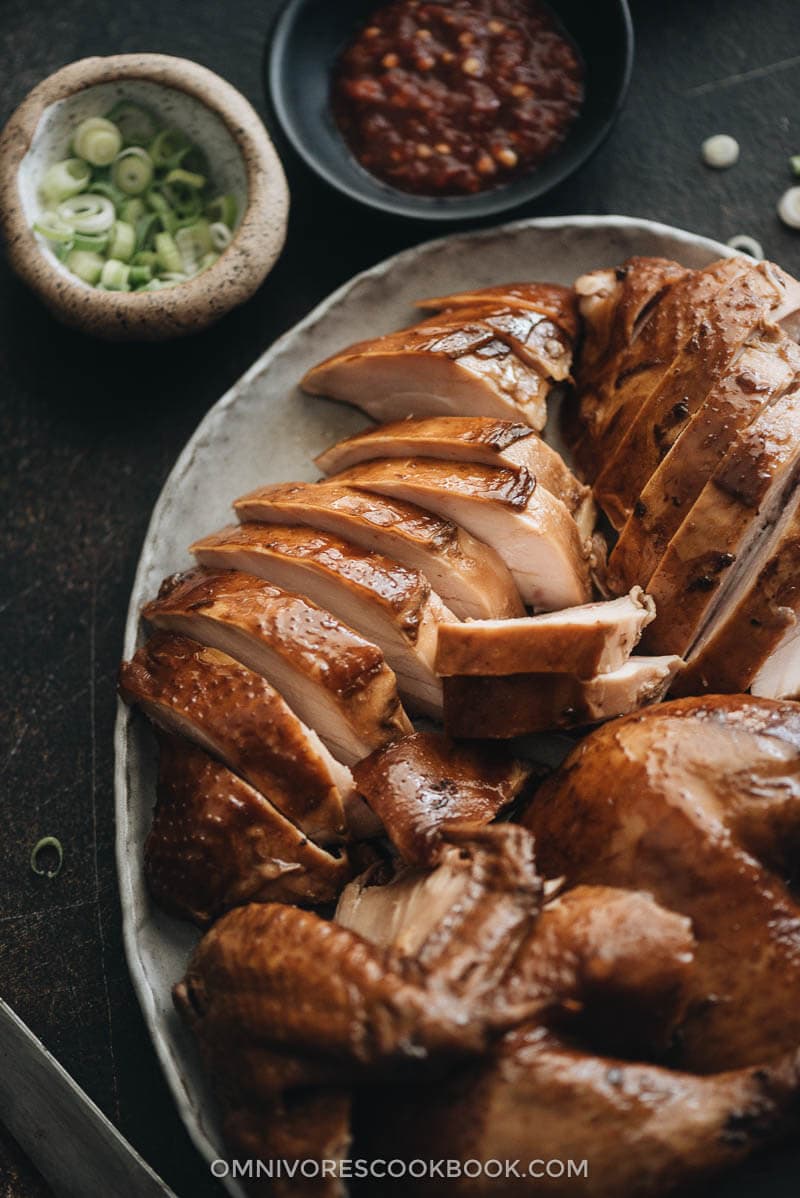 Chinese Soy Sauce Chicken - This homemade soy sauce chicken has silky tender meat with a deep savory flavor. Learn how easy it is to make this Cantonese dim sum at home and even achieve restaurant taste. #marinade #recipe #healthy #glutenfree #brownsugar Sliced homemade soy sauce chicken close up