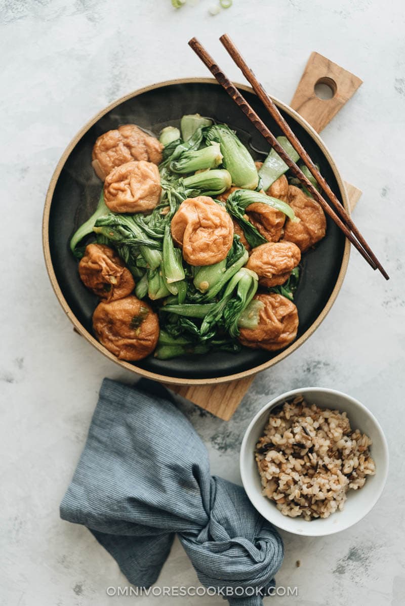 Stir Fried Baby Bok Choy with Gluten Balls - Very easy to make and bursting with flavor, it’s a great choice if you’re trying to find an interesting way to spice up your vegetarian meal and add a dose of plant-based protein. #chinese #recipes #vegan #stirfry Stir fried baby bok choy with gluten balls served with brown rice