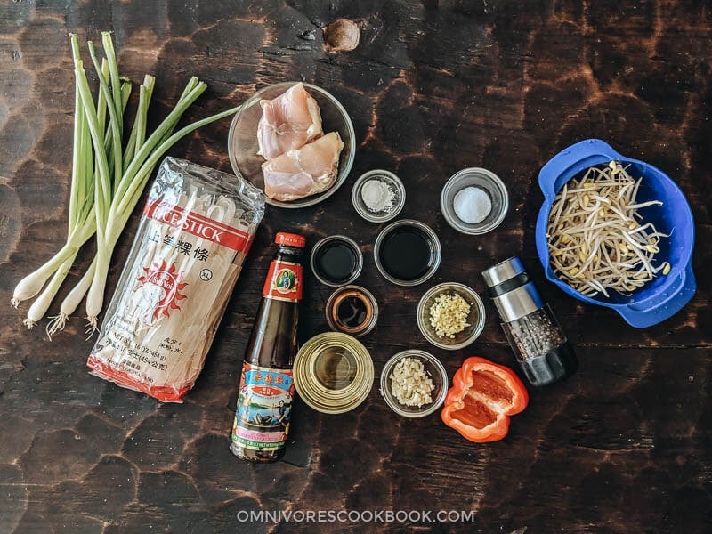 15-Minute Chicken Chow fun - This chicken fried noodle recipe is super fast to make and yields restaurant-style results. The dish is loaded with fat rice noodles, tender chicken, and crisp veggies. No wok required! #recipe #comfortfood #stirfry #glutenfree Ingredients for making chicken chow fun at home
