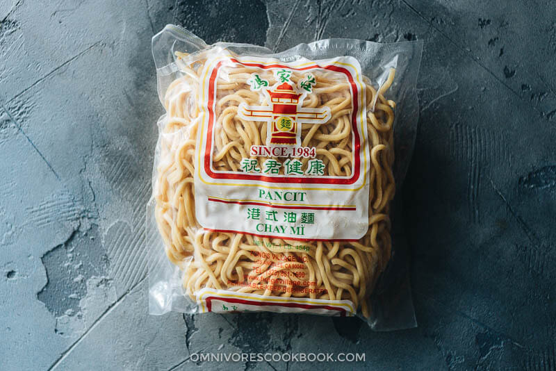 Hokkien Prawn Mee Noodle Soup (Hae Mee) - Tender yellow noodles in a rich savory-sweet red-orange broth served with juicy prawns, fish cakes, crunchy bean sprouts, and crispy fried shallots. {Gluten-Free adaptable} Noodles to use in Hae Mee