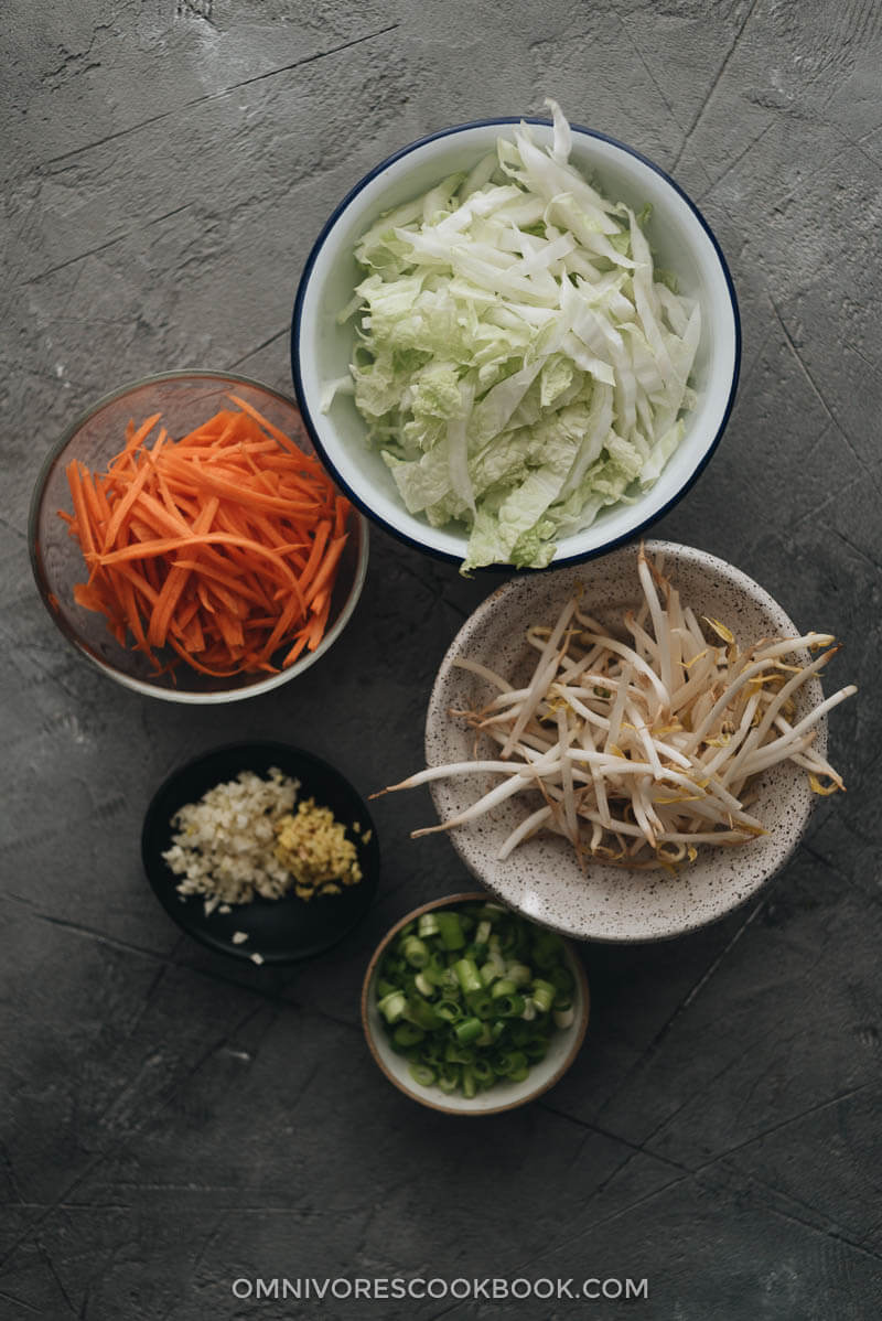 Chinese egg rolls - The ultimate guide to making restaurant-style egg rolls at home. These Chinese egg rolls are filled with tender meat and crunchy vegetables. I’ve included three cooking methods in this recipe and all of them yield a very crispy crust. Make them ahead and serve them as an appetizer at your dinner party or as a snack. #dimsum #takeout Vegetables for making Chinese egg rolls