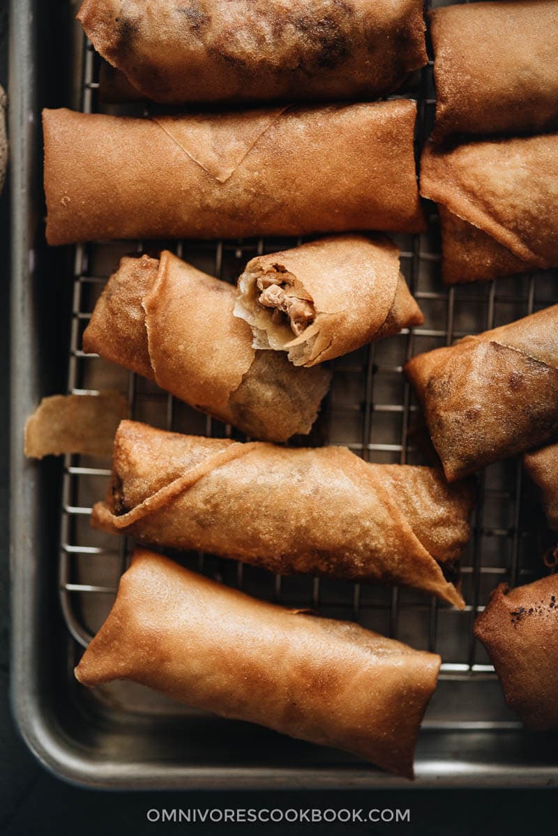 Chinese egg rolls - The ultimate guide to making restaurant-style egg rolls at home. These Chinese egg rolls are filled with tender meat and crunchy vegetables. I’ve included three cooking methods in this recipe and all of them yield a very crispy crust. Make them ahead and serve them as an appetizer at your dinner party or as a snack. #dimsum #takeout Homemade Chinese egg rolls Close up