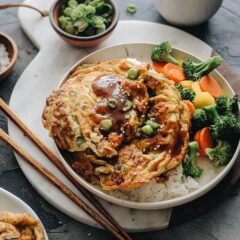 Easy Egg Foo Young - Crispy fluffy egg foo young filled with crisp veggies and aromatic green onion and served with a rich brown sauce. It&rsquo;s super easy to make and tastes so satisfying. Serve it with steamed rice and veggies and you&rsquo;ll have a nutritious meal in no time.