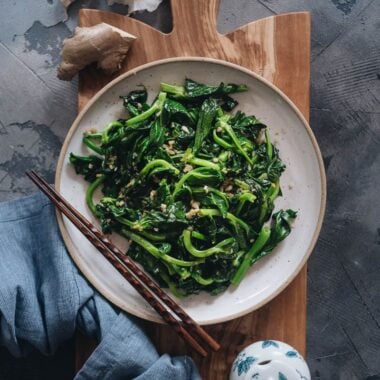 Homemade stir-fried pea shoots with garlic