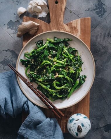 Homemade stir-fried pea shoots with garlic