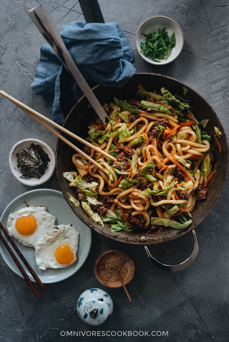 Easy Fried Udon - An easy fried udon recipe with a Chinese twist that yields a rich result that tastes like a beef burger. The recipe calls for very basic ingredients and doesn’t require a wok. Try it out if you like takeout - you’ll like this homemade version even better. Homemade fried udon in a pan