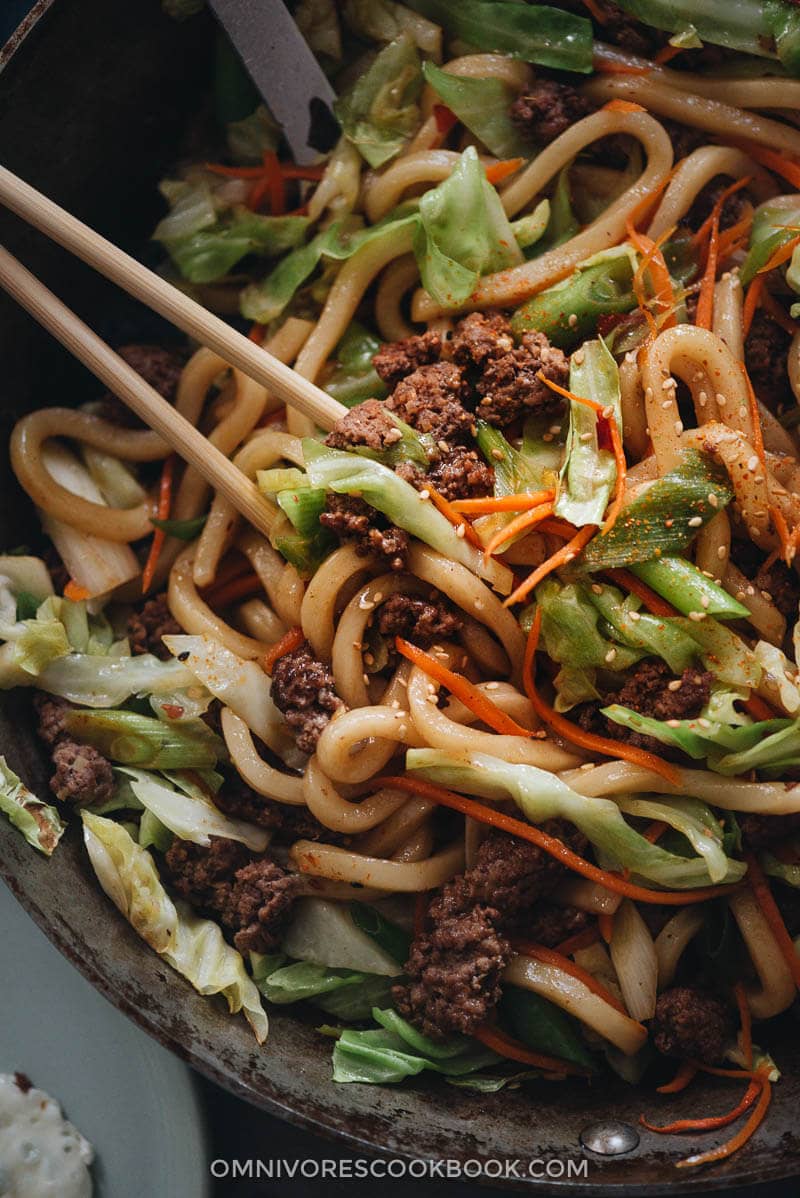 Easy Fried Udon - An easy fried udon recipe with a Chinese twist that yields a rich result that tastes like a beef burger. The recipe calls for very basic ingredients and doesn’t require a wok. Try it out if you like takeout - you’ll like this homemade version even better. Fried udon in a pan close up