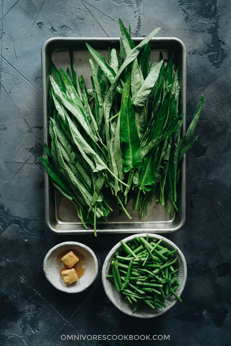 Stir-Fried Water Spinach - Two Ways | Introducing two ways to cook stir-fried water spinach, and both require fewer than five ingredients. Try out this Chinese leafy green to add color and nutrition to your dinner table. {Vegan, Gluten-Free} Prepared water spinach before cooking