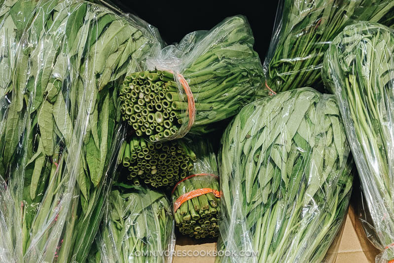 Stir-Fried Water Spinach - Two Ways | Introducing two ways to cook stir-fried water spinach, and both require fewer than five ingredients. Try out this Chinese leafy green to add color and nutrition to your dinner table. {Vegan, Gluten-Free} Water spinach in Asian market