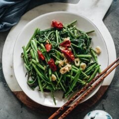 Stir-Fried Water Spinach - Two Ways | Introducing two ways to cook stir-fried water spinach, and both require fewer than five ingredients. Try out this Chinese leafy green to add color and nutrition to your dinner table. {Vegan, Gluten-Free}