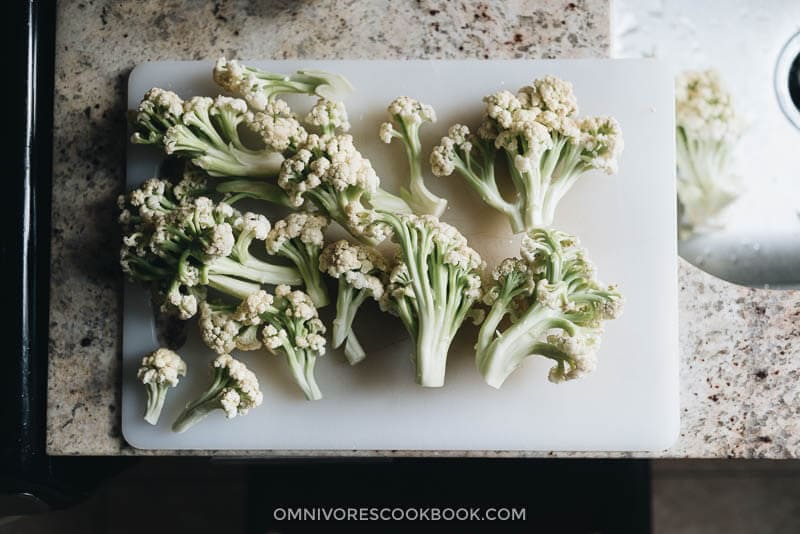Chinese Cauliflower Stir Fry (干锅菜花) - These crunchy cauliflower bites are cooked in a numbing spicy sauce that is so rich. Even though this recipe is vegan, I’ve included notes on how to add different types of protein, to make a more substantial dish for your dinner. {Vegan, Gluten-Free Adaptable} Chopped Chinese cauliflower