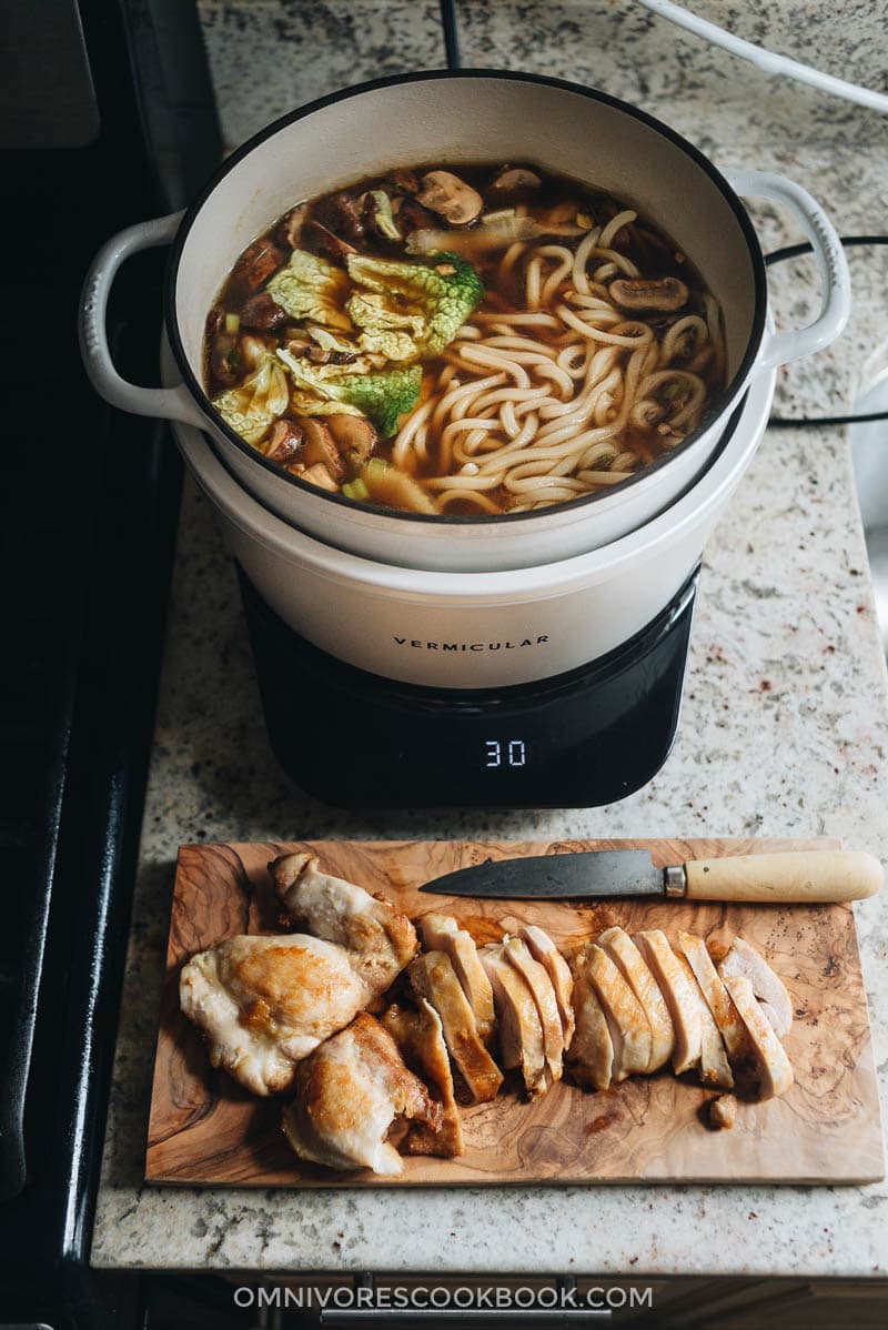 Chicken Udon Soup - A super simple one-pot noodle soup that guarantees maximum satisfaction with beautifully charred chicken, rich soup, thick noodles, and tender veggies. Cooking chicken udon soup in Vermicular Musui-Kamado