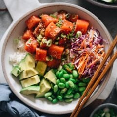 Salmon poke bowl - a perfect one-bowl meal that&rsquo;s easy to make and packed with nutrition. The recipe uses an extra aromatic sauce that has the right balance of savory, sour, sweet, and spicy. The dish is quick enough to make for a weekday dinner and fancy enough to serve at your weekend dinner party. {Gluten-free adaptable}