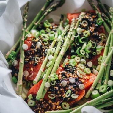 Making steamed salmon with black bean sauce close-up