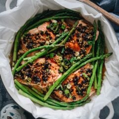 Steamed Salmon in Black Bean Sauce - The steamed salmon is cooked until tender and moist and the asparagus perfectly done. The dark black bean sauce complements both ingredients perfectly and turns these simple ingredients into a feast. The dish takes no time to set up and cook. And you&rsquo;ll get a nutritious and delicious one-pan dinner in 30 minutes. {Gluten-Free adaptable}