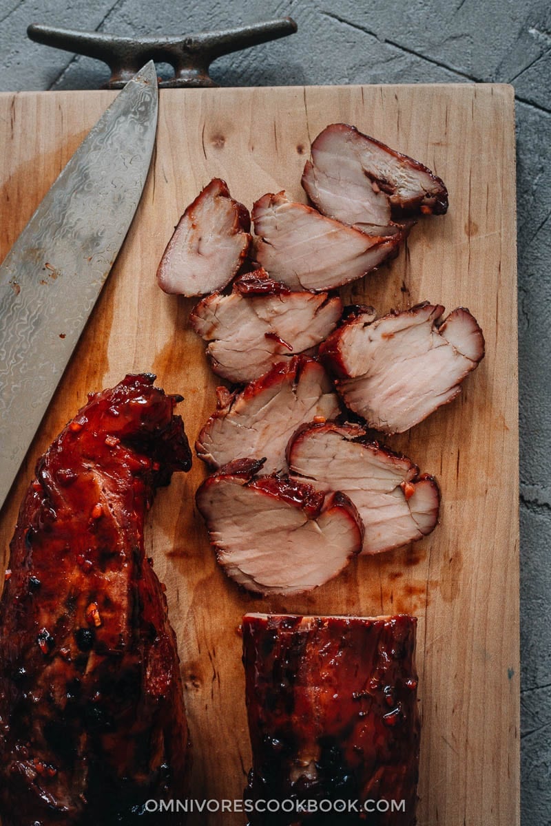 Char Siu (Chinese BBQ Pork, 叉烧肉) - The only char siu recipe you need to make juicy flavorful pork with a sweet glossy glaze, just like you’d get at a Cantonese restaurant. {Gluten-Free adaptable} Sliced Chinese BBQ pork on cutting board
