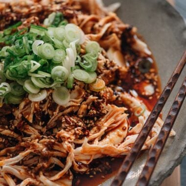 Sichuan-style shredded chicken in red oil close-up