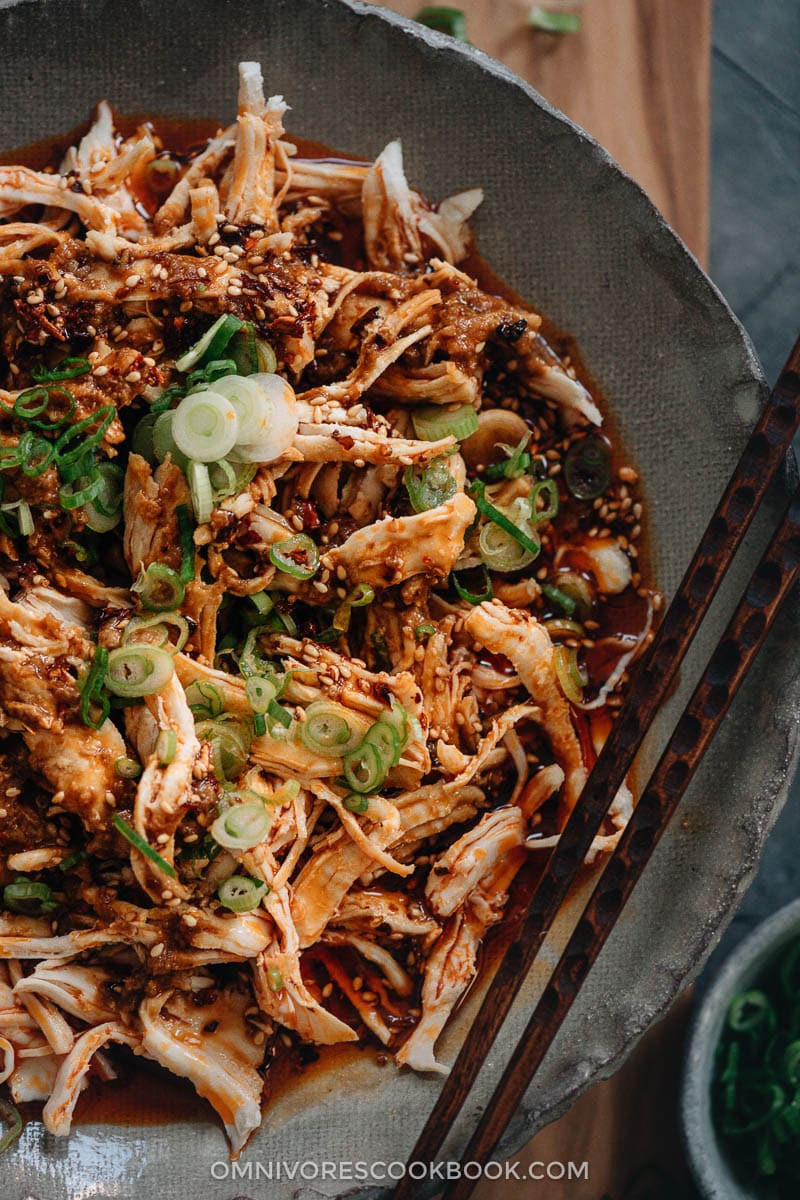 Chinese Bang Bang Chicken (棒棒鸡) - The real-deal Sichuan version of Bang Bang chicken made with juicy tender shredded chicken breast covered with a savory, nutty, spicy sauce with a hint of tangy and sweet notes. Originally a traditional Chinese appetizer, make it ahead and serve it at your next movie night or game day party. Mind blow guaranteed. Chinese bang bang chicken