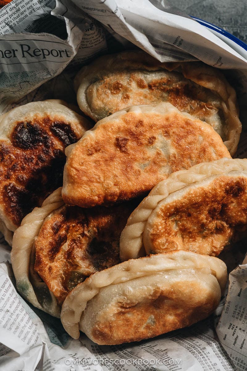 Chinese Chive Pockets (韭菜盒子, Chinese Chive Dumplings) | The super crispy and thin dough is stuffed with a hearty, savory filling made with Chinese chives and scrambled eggs. They’re easier to make than potstickers and have all the goodness that dumplings have, only more satisfying! Homemade Chinese chive dumplings close-up