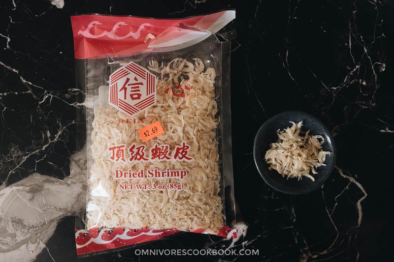 Chinese Chive Pockets (韭菜盒子, Chinese Chive Dumplings) | The super crispy and thin dough is stuffed with a hearty, savory filling made with Chinese chives and scrambled eggs. They’re easier to make than potstickers and have all the goodness that dumplings have, only more satisfying! Dried papery shrimps