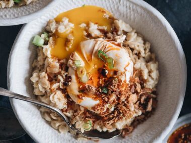5-Ingredient Savory Oatmeal (Chinese-Style) | This oatmeal is simmered with chicken stock until creamy, topped with runny eggs, seasoned with soy sauce and chili oil, and finished up with crispy fried shallots. This breakfast dish is so easy to put together and the combo creates a bold taste with a beautiful texture. {Gluten-Free adaptable}