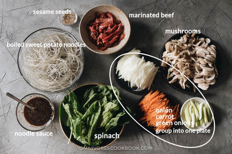 Japchae (Korean Sweet Potato Noodles) | Make japchae at home for a comforting, delicious, and nutritionally balanced weekday dinner. The tender sweet potato noodles are tossed with charred beef and crispy veggies in a sweet savory sauce. This easy recipe uses shortcuts to make the cooking process faster than the traditional recipe. {Gluten Free adaptable, vegan adaptable} Ingredients for making Korean sweet potato noodles
