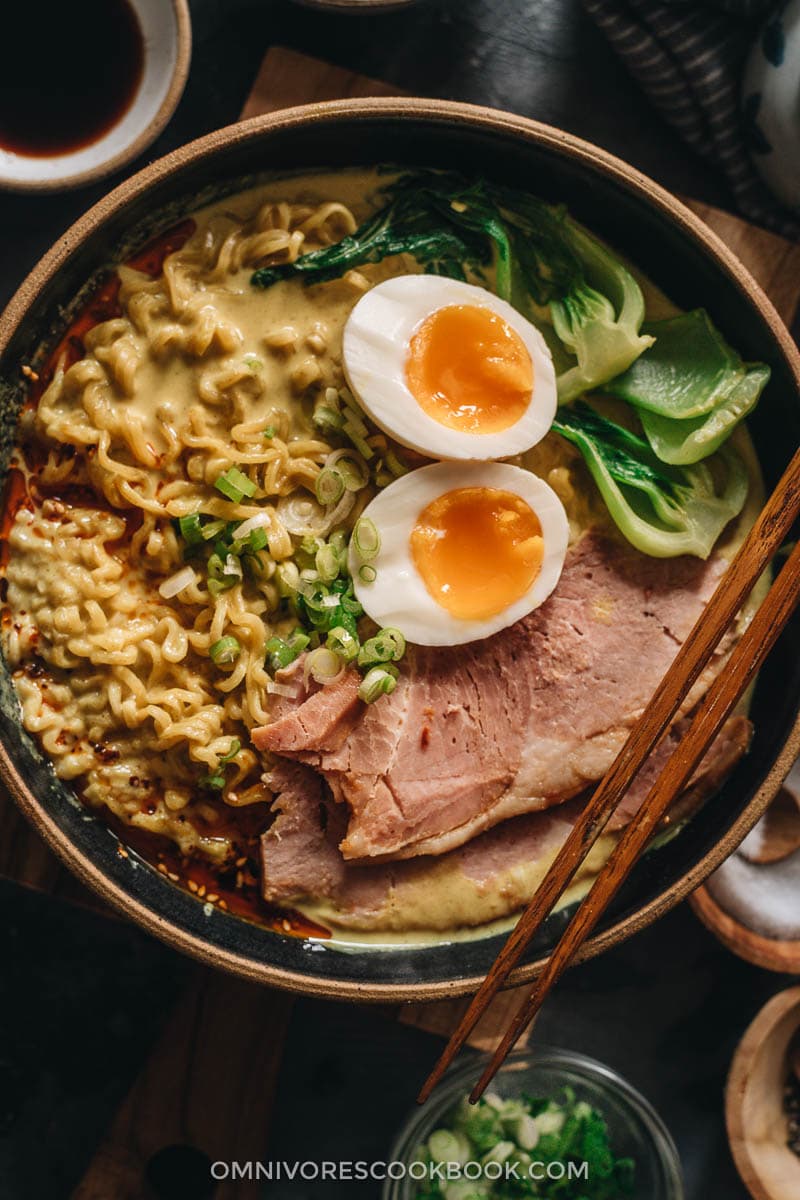 15-Minute Curry Ramen with Leftover Ham | A super easy recipe that turns your leftover ham into a scrumptious one-pot dinner. The curry broth is made with coconut milk, butter, and garlic to create a super rich texture that’s bursting with flavor. I’ve included notes so you can tweak the recipe using ingredients you already have in your pantry. {Gluten-Free adaptable} Curry ramen topped with leftover ham close up