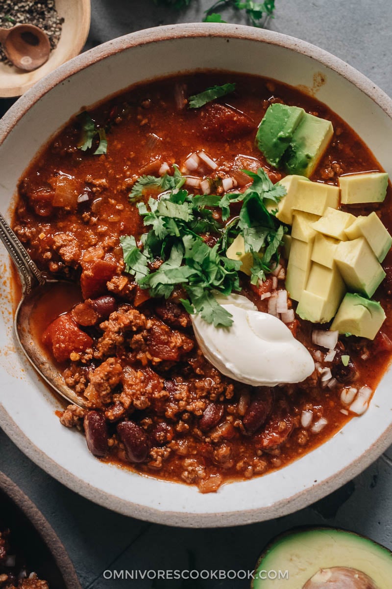 Chinese Chili (Sichuan Style) | Make a hearty pot of chili using Sichuan ingredients to create a super rich and deep umami while keeping the essence of a traditional chili. The recipe teaches you how to make a flavorful chili paste, but you can also use chili powder to make the recipe super easy. Chili served with cream cheese, cilantro, and avocado