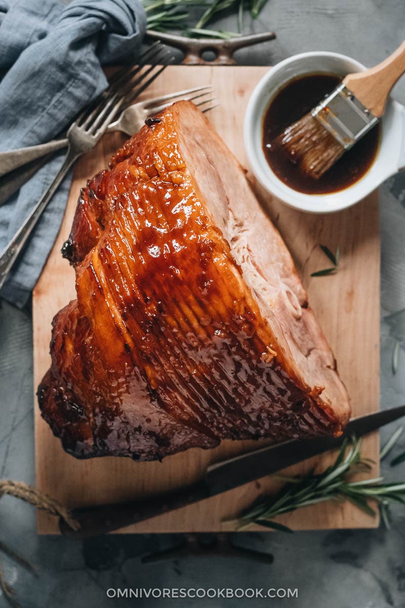 Asian Pineapple Glazed Ham | Try out this easy pineapple glazed ham if you want to make a traditional glazed ham with something new, while staying just as hearty and comforting. The glaze is made from brown sugar and pineapple juice, with a hint of gingery and garlicky taste, just like sweet chili sauce. It is a perfect centerpiece dish for holidays such as Christmas and Easter. {Gluten-Free Adaptable} Pineapple glazed ham with glaze