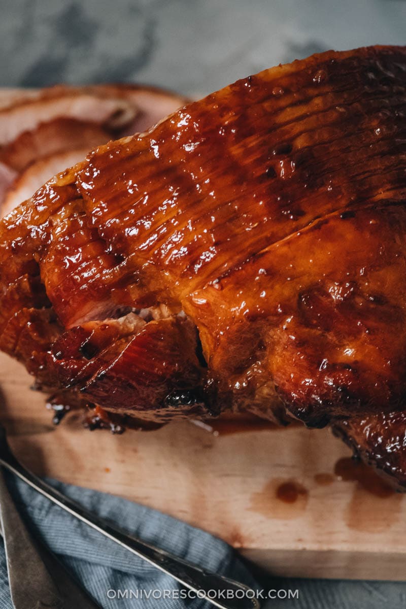 Asian Pineapple Glazed Ham | Try out this easy pineapple glazed ham if you want to make a traditional glazed ham with something new, while staying just as hearty and comforting. The glaze is made from brown sugar and pineapple juice, with a hint of gingery and garlicky taste, just like sweet chili sauce. It is a perfect centerpiece dish for holidays such as Christmas and Easter. {Gluten-Free Adaptable} Pineapple glazed ham close-up