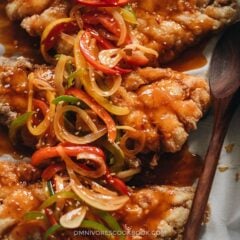 Chinese Sweet and Sour Fish (糖醋鱼) | This recipe uses fish fillets to create a stunning presentation while keeping the cooking process as easy as possible. The fish is shallow-fried until super crispy and then drizzled with a rich and aromatic sauce that is loaded with colorful peppers. It&rsquo;s a perfect dish to serve at your dinner party, for Chinese New Year, or for other Chinese festivals. {Gluten-Free Adaptable}